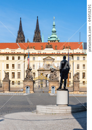 Hradcany square with entrance gate to Prague Castle and statue of Tomas Garrigue Masaryk - the first President of Czechoslovakia, Praha, Czech Republic 64958291