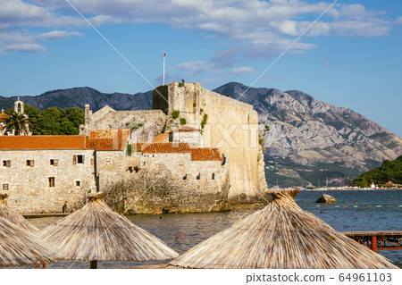 Budva old town beach and Citadel fortress city wall in Budva, Montenegro Budva old town beach and Citadel fortress city wall in Budva, Montenegro 64961103