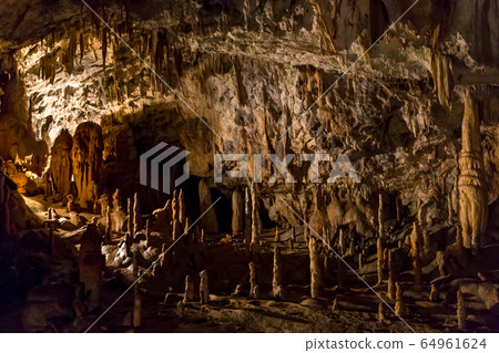 Postojna cave, Slovenia. Formations inside cave with stalactites and stalagmites Postojna cave, Slovenia. Formations inside cave with stalactites and stalagmites 64961624