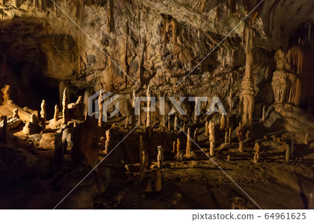 Postojna cave, Slovenia. Formations inside cave with stalactites and stalagmites Postojna cave, Slovenia. Formations inside cave with stalactites and stalagmites 64961625