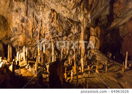 Postojna cave, Slovenia. Formations inside cave with stalactites and stalagmites Postojna cave, Slovenia. Formations inside cave with stalactites and stalagmites 64961626