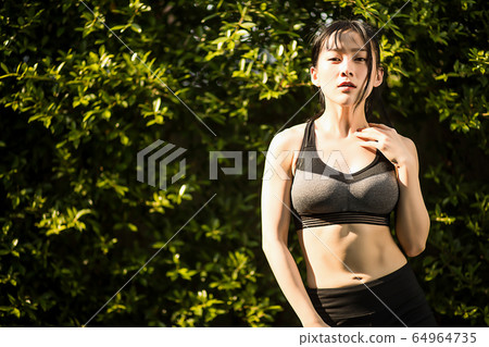 Young women exercise sports healthy outdoor park fitness person material 64964735