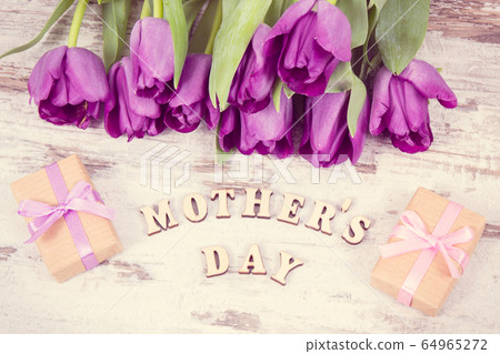 Vintage photo, Purple tulips and gifts Vintage photo, Purple tulips and gifts 64965272
