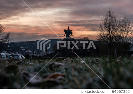 Colorful Sunrise burning sky Koblenz City historic monument German Corner where river rhine and mosele flow together 64967203