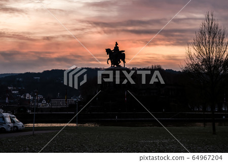 Colorful Sunrise burning sky Koblenz City historic monument German Corner where river rhine and mosele flow together 64967204
