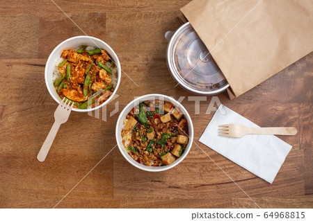 Delivery takeaway asian food. Convenient meal in paper food box Delivery takeaway asian food. Convenient meal in paper food box 64968815