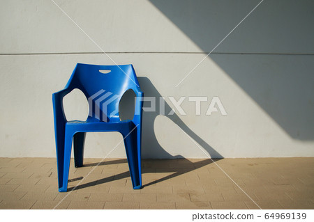 Art of Blue chair with oblique light background Art of Blue chair with oblique light background 64969139