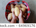 A Potato on the hands of children 64969176