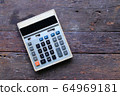 Vintage calculator on Old wood background 64969181
