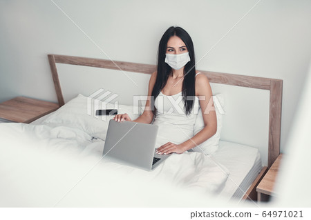 Relaxed young female being deep in her thoughts Relaxed young female being deep in her thoughts 64971021