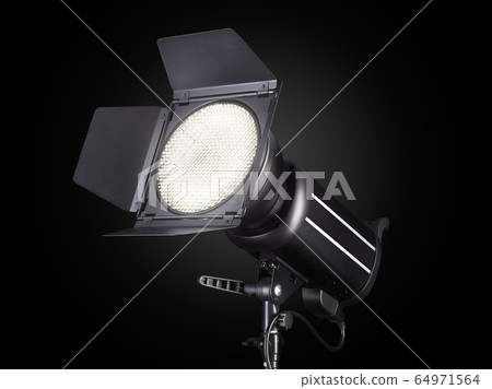 Photography studio flash isolated on black Photography studio flash isolated on black 64971564