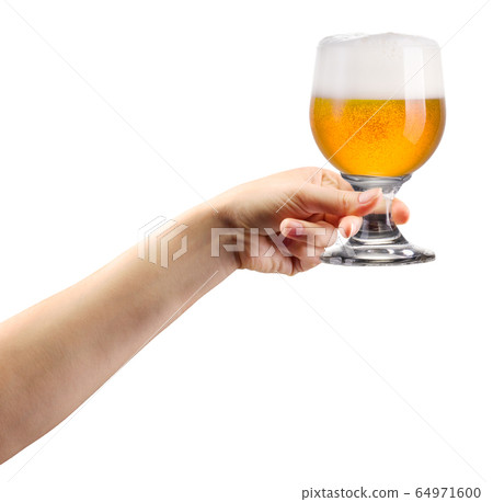 Woman hand holding glass of lager beer isolated on Woman hand holding glass of lager beer isolated on 64971600