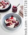 Cottage cheese pancakes with berry sauce and nuts. Healthy breakfast concept. 64971728