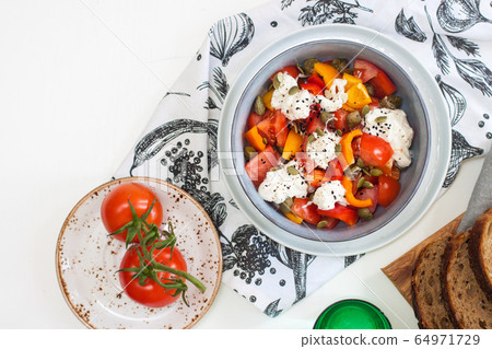 Healthy salad with grilled pepper, tomatoes, stracciatella, herbs and pumpkin seeds. Healthy eating concept. Healthy salad with grilled pepper, tomatoes, stracciatella, herbs and pumpkin seeds. Healthy eating concept. 64971729