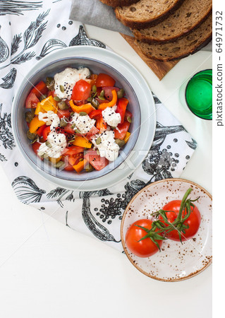 Healthy salad with grilled pepper, tomatoes, stracciatella, herbs and pumpkin seeds. Healthy eating concept. Healthy salad with grilled pepper, tomatoes, stracciatella, herbs and pumpkin seeds. Healthy eating concept. 64971732