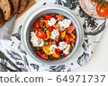 Healthy salad with grilled pepper, tomatoes, stracciatella, herbs and pumpkin seeds. Healthy eating concept. 64971737