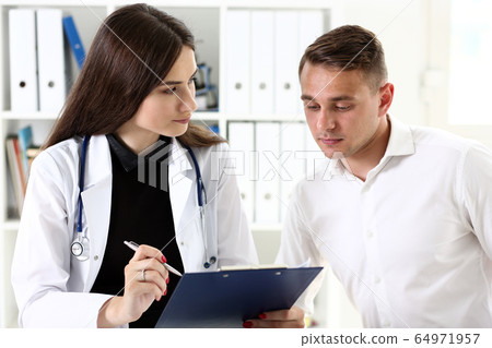 Smiling beautiful female medicine doctor explain diagnosis Smiling beautiful female medicine doctor explain diagnosis 64971957