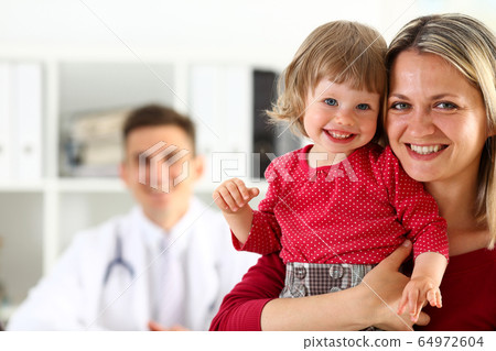 Little child with mother at pediatrician reception 64972604