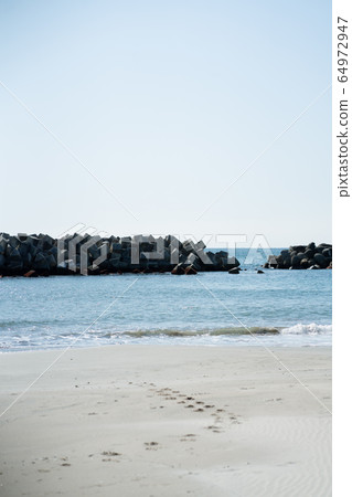 Sea beach footprints beach clear sunny dramatic 64972947