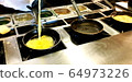 Cooking omelettes and fried eggs. Breakfast buffet 64973226