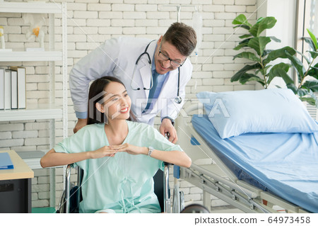 The doctor is taking care of the patient The doctor is taking care of the patient 64973458