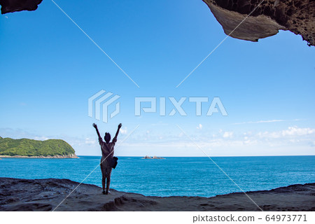Mie Prefecture Kumano City Onigajo Woman overlooking the sea Mie Prefecture Kumano City Onigajo Woman overlooking the sea 64973771