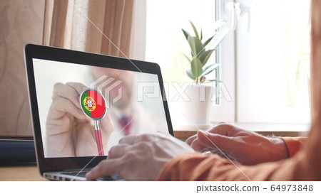 Doctor's advice on computer app, stethoscope with the Portuguese flag. Telehealth technology in Portugal Doctor's advice on computer app, stethoscope with the Portuguese flag. Telehealth technology in Portugal 64973848