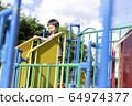 Children playing in the park 64974377