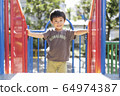 Children playing in the park 64974387