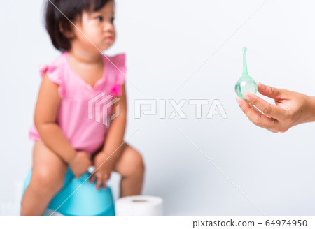 baby child girl training to sitting on blue 64974950