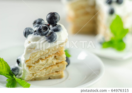 Delicious pancakes with sweet creamy yogurt and 64976315