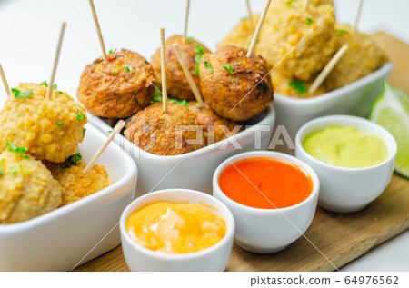Various mini chicken kievs and sweet potato 64976562