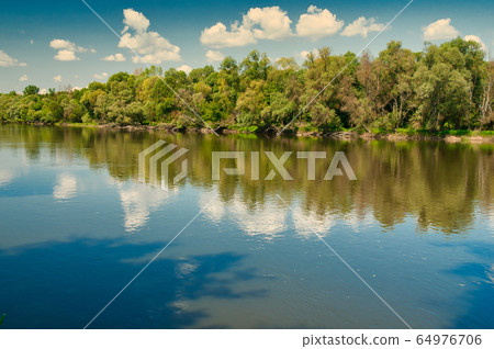 .Summer landscape with the river under the blue .Summer landscape with the river under the blue 64976706