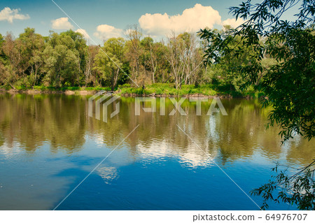 .Summer landscape with the river under the blue .Summer landscape with the river under the blue 64976707