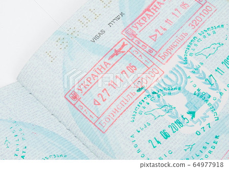 Border crossing stamps in the passport 64977918