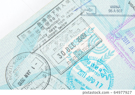 Border crossing stamps in the passport Border crossing stamps in the passport 64977927