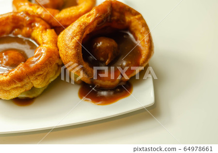 Traditional English Yorkshire pudding with Traditional English Yorkshire pudding with 64978661