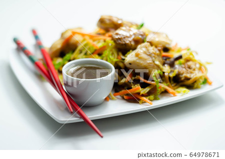 Cooked chicken breast pieces with savory garlic 64978671