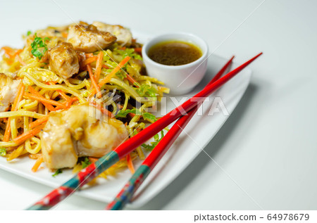 Cooked chicken breast pieces with savory garlic 64978679