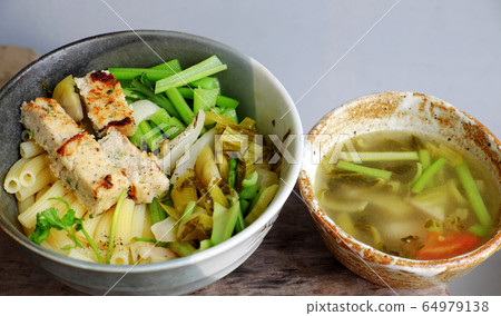 vegetarian Penne pasta soup bowl with vegetables, vegan food from macaroni with kale, tofu pie vegetarian Penne pasta soup bowl with vegetables, vegan food from macaroni with kale, tofu pie 64979138