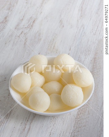 indian traditional sweet rasgulla, close up indian traditional sweet rasgulla, close up 64979271