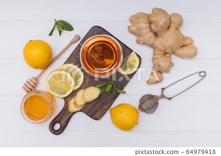 Healthy vitamin ginger tea with honey and lemon 64979418
