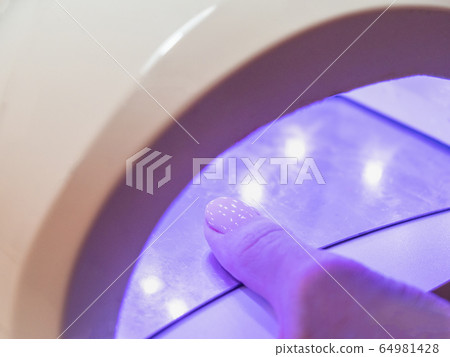 UV lamp and Nail Polish drying. Close up 64981428