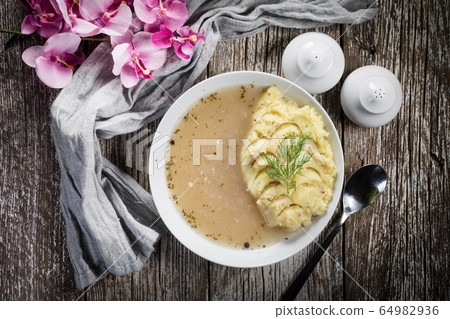 Pure white borscht served with mashed potatoes. Pure white borscht served with mashed potatoes. 64982936