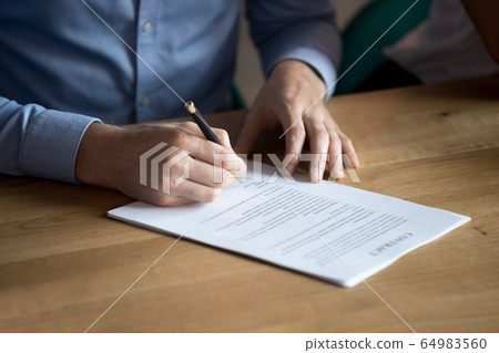 Business man customer hand sign contract, close up view 64983560