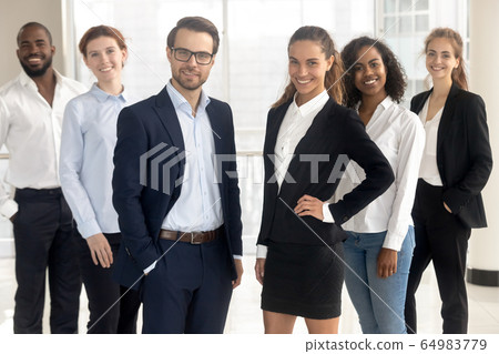 Smiling professional leaders coaches looking at camera with employees businesspeople Smiling professional leaders coaches looking at camera with employees businesspeople 64983779