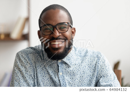 Happy african american businessman coach smiling looking at camera, portrait 64984132