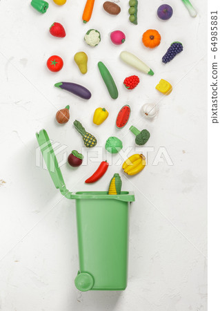 Food Waste Prevention Concept. Food in Garbage Bin Food Waste Prevention Concept. Food in Garbage Bin 64985881