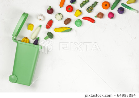 Food Waste Prevention Concept. Food in Garbage Bin 64985884