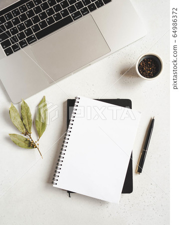Kitchen notepad mockup for culinary text, laptop, and spices on a light background. Top view 64986372